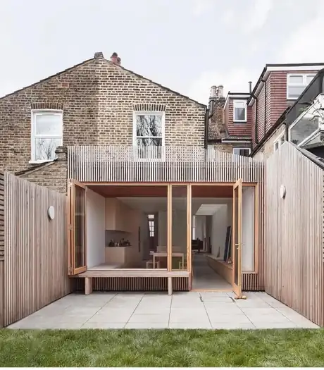 Cedar-clad side and rear extension in Latimer Road