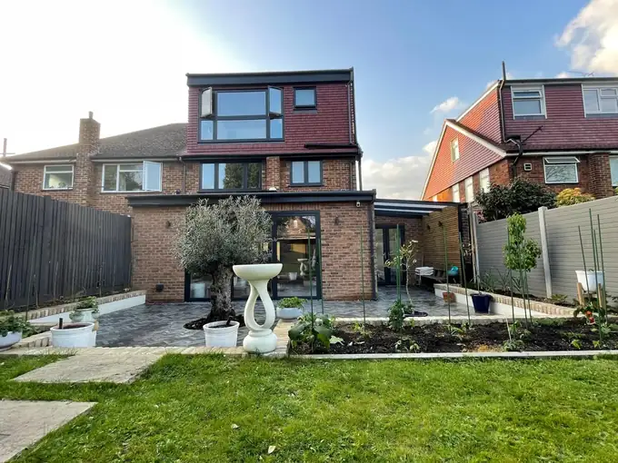 Rear of the Wimbledon house after works, with dormer loft, extension and garden
