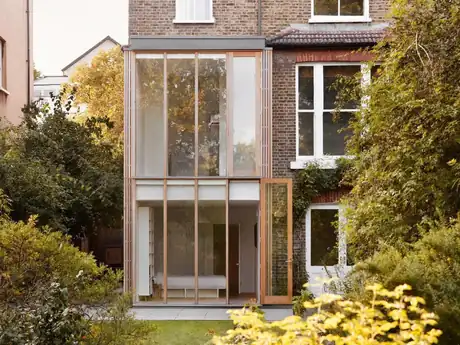 Two-storey extension in West Hampstead with full-height oak-framed glazing